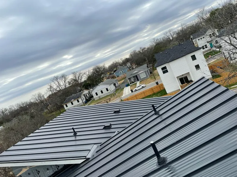 Standing seam metal roof panels with vents for Skylight Repair in Vinton